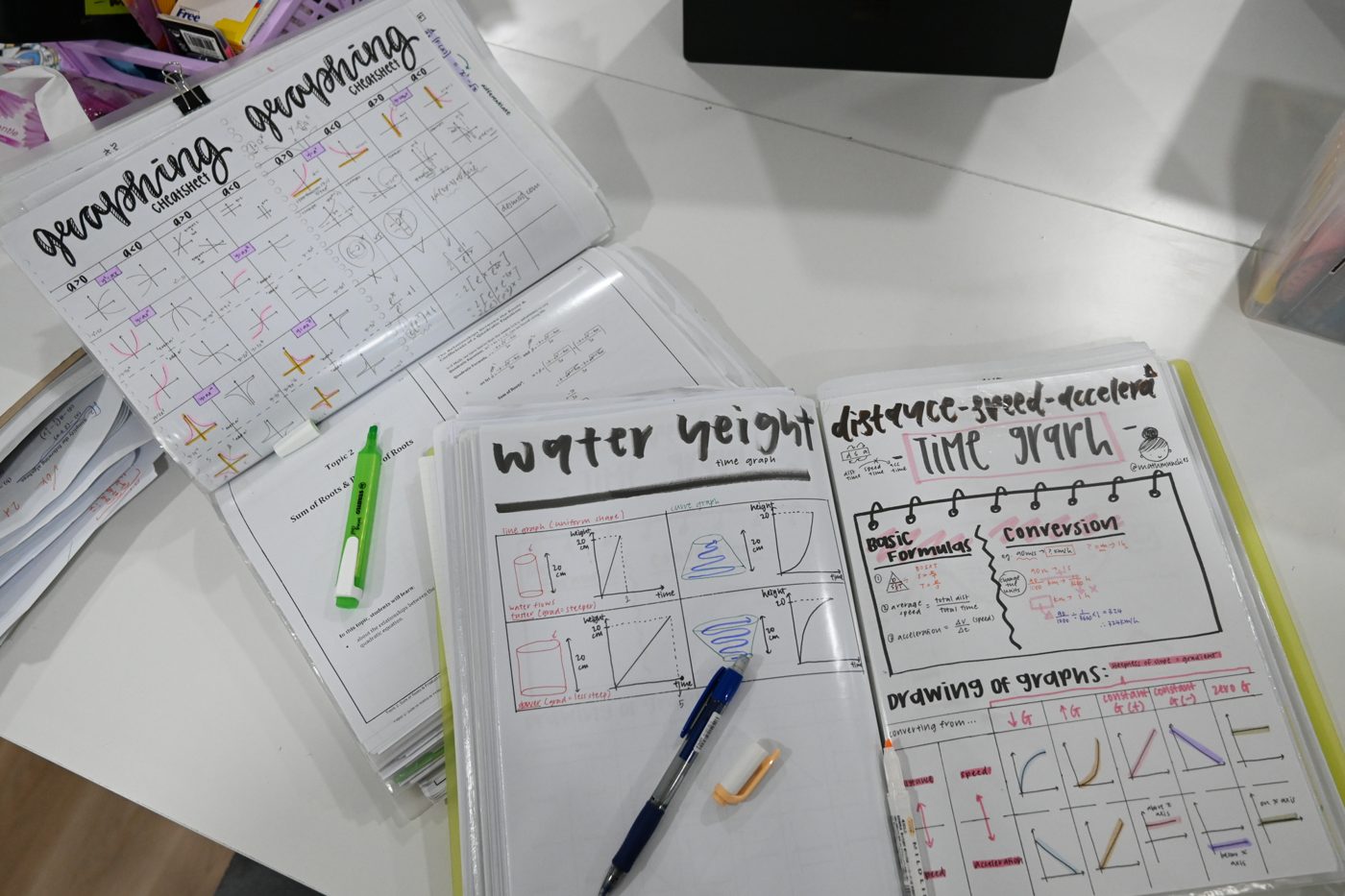 Handwritten revision notes laid out on a desk